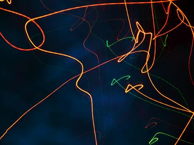 Abstract light patterns on a dark wall reflecting calm energy