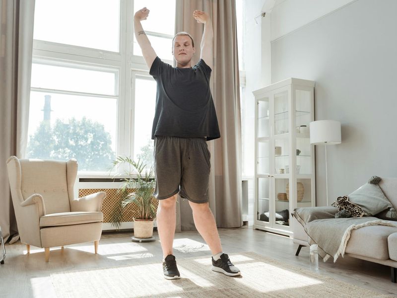 Person doing morning exercises in a bright minimalist room